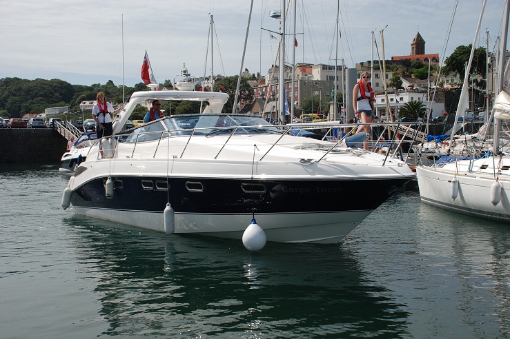 A motor cruiser arrives at a port in a foreign country