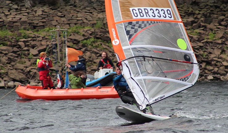 Windsurfer crossing the startline at BYS Windsurfing Regional Junior Championship, Glossop, 2022