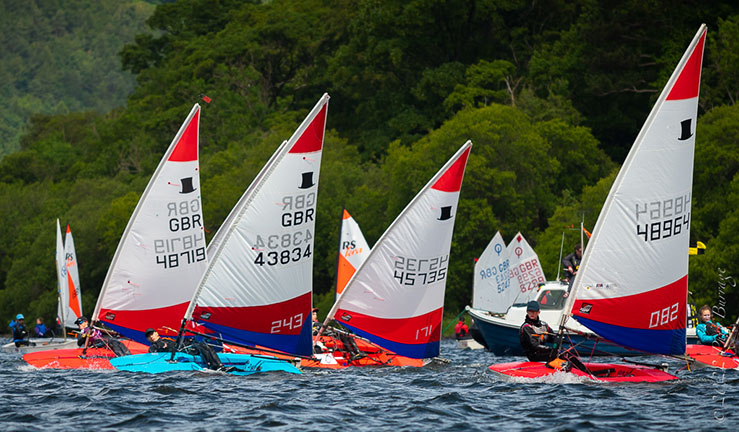 Topper dinghies racing with other junior boats in the background at Ullswater, BYS North Junior Champs 2022.