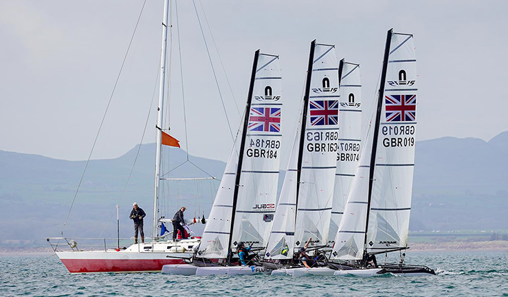 Nacra 15s line up for a race start at RYA Youth Nationals