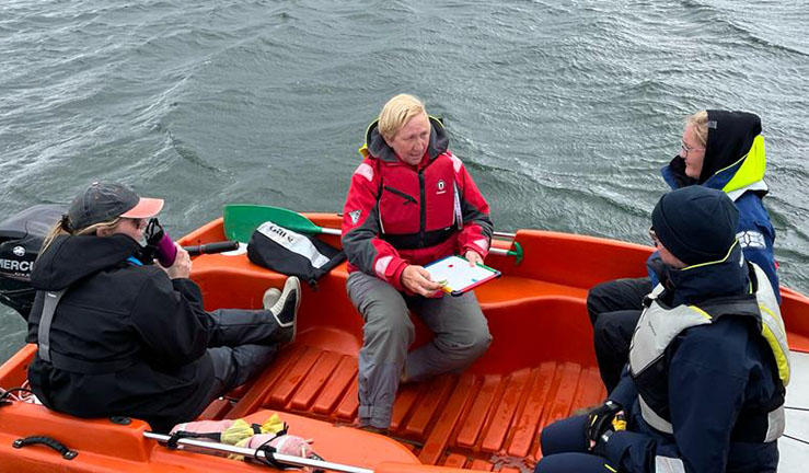 Patricia Ordsmith leads an on-water session on a RIB with three others on board as part of the RYA Midlands Aspiring Female Powerboat Instructor programme.