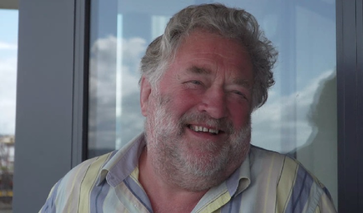 Colin Loughead smiling to camera, ashore.