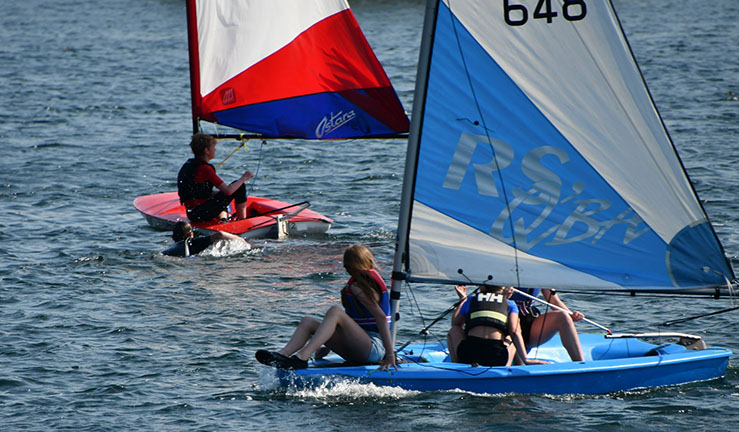 Five juniors at Ripon SC having fun messing about in Topper dinghies at the club's Commodore's Weekend for families.