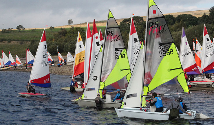 Lots and lots of junior dinghies with colourful sails launching from the shore at Derwent Reservoir SC for the Regional Junior Championships 2021.