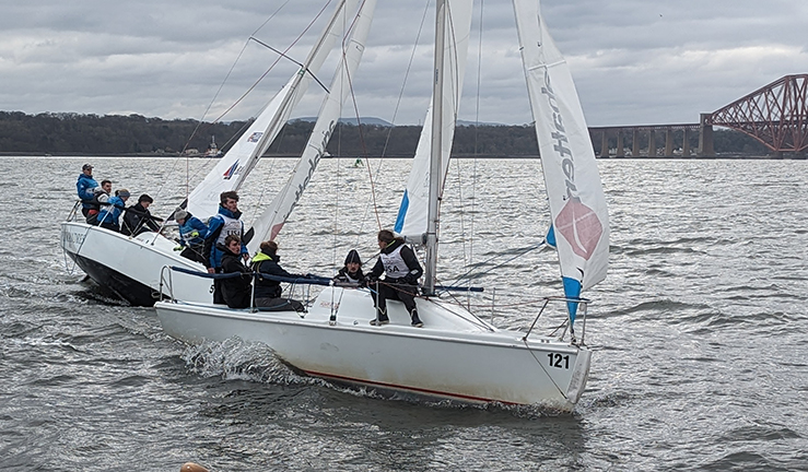 Students sailors on small &)& keelboats racing on the Firth of Forth.