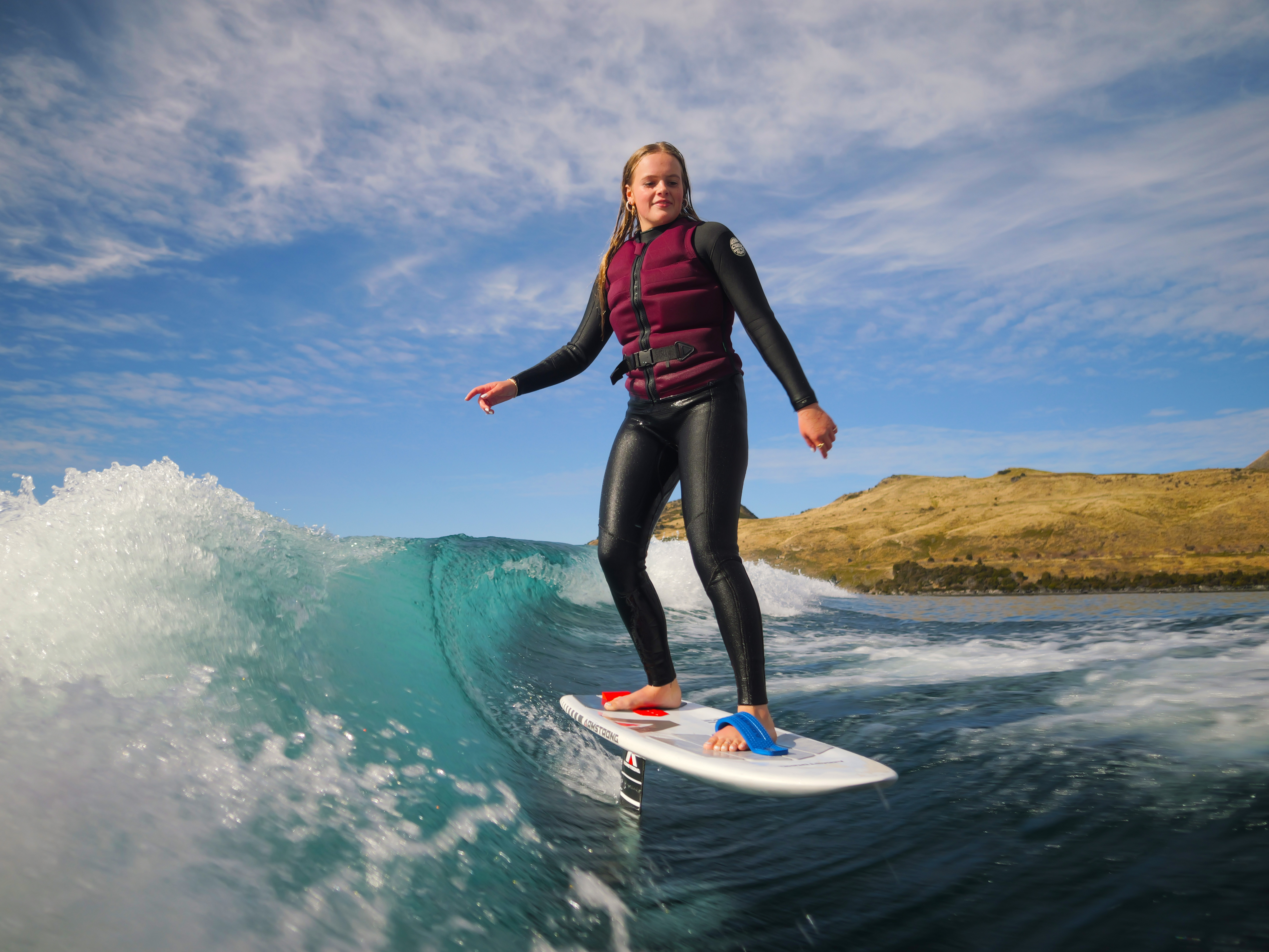 Young person foiling on wave - mid shot 