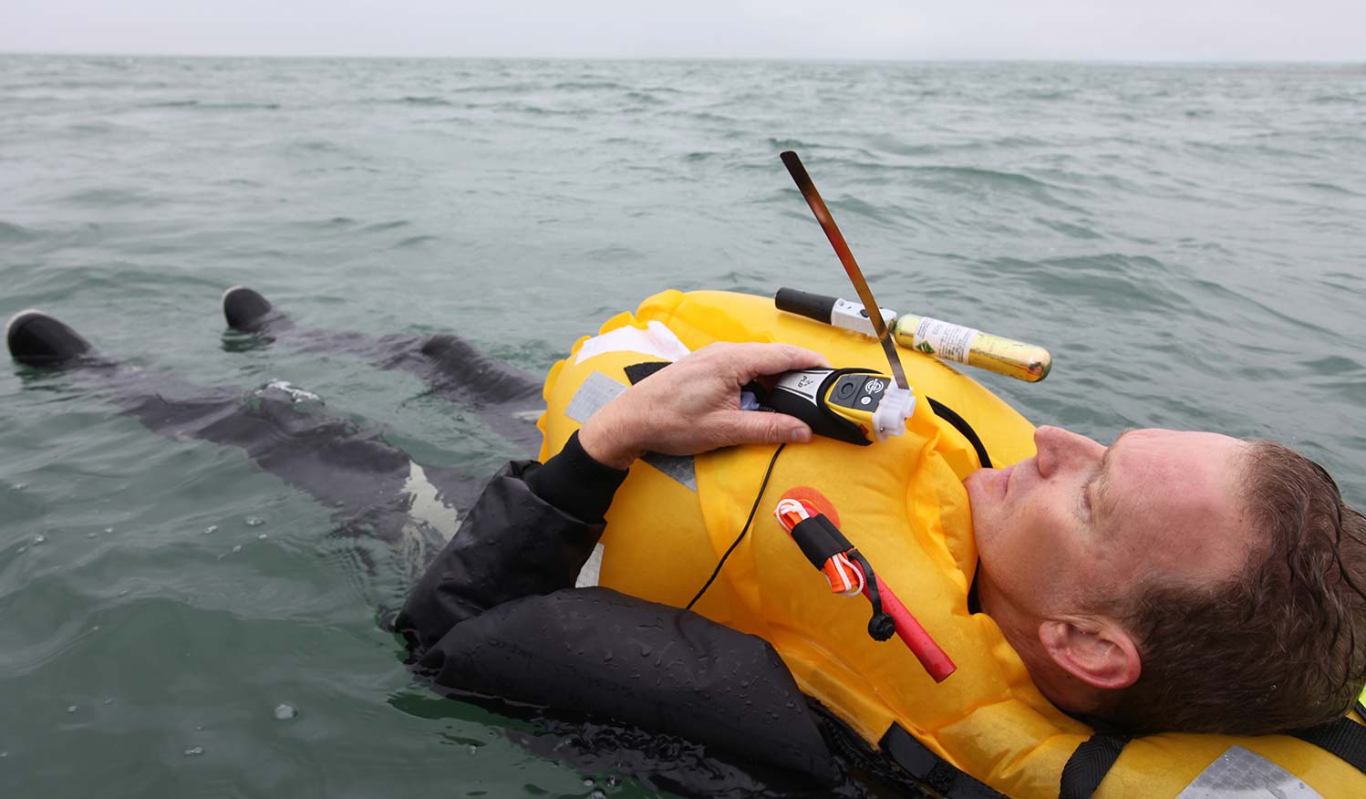 close up shot of man lying back in water in life water 