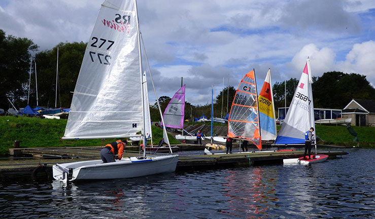 Boats on the shore in front of Otley SC 