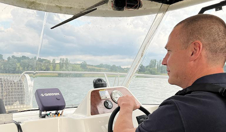 RYA Midlands Regional Development Officer Ben Hodgson driving the committee boat at Hollowell SC.