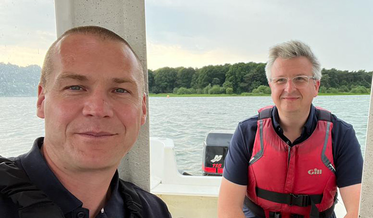 RYA Midlands Regional Development Officer Ben Hodgson on a boat at Hollowell SC with commodore James Avery.