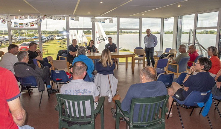 CEO Sarah Sutcliffe addresses a group of seated members inside the clubhouse at Notts County SC. 