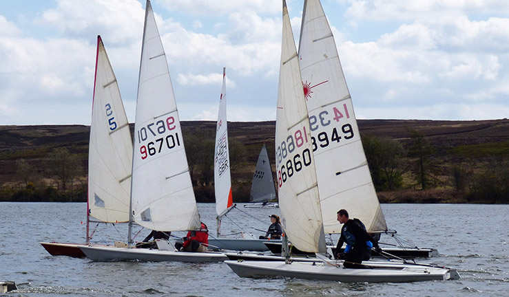 Five singlehanded boats racing on the lake at Scaling Dam SC.