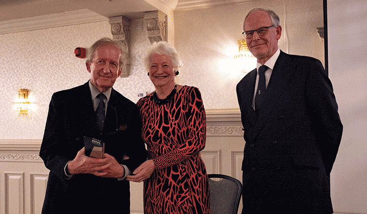 James Nixon being inducted into the RYANI Hall of Fame, standing with Dame Mary Peters and RYA Chair Chris Preston