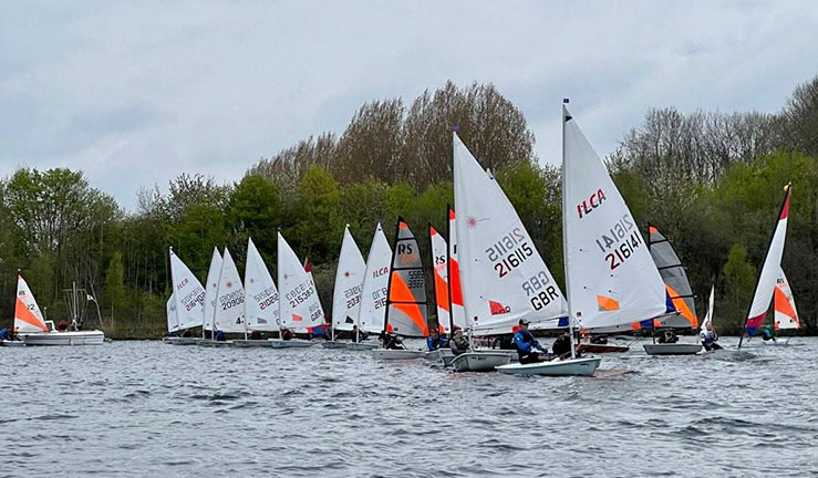 Variety of youth and junior boats lining up on a startline at Ripon SC for a NE & Yorkshire Youth Traveller Series open meeting 2022.