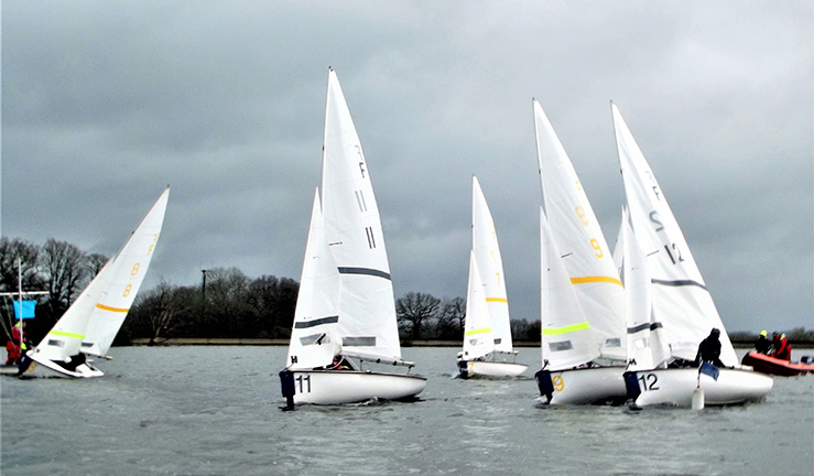 Teams racing Firefly dinghies at the RYA UKTRA National Team Racing Championships, Bough Beech SC, 2023.