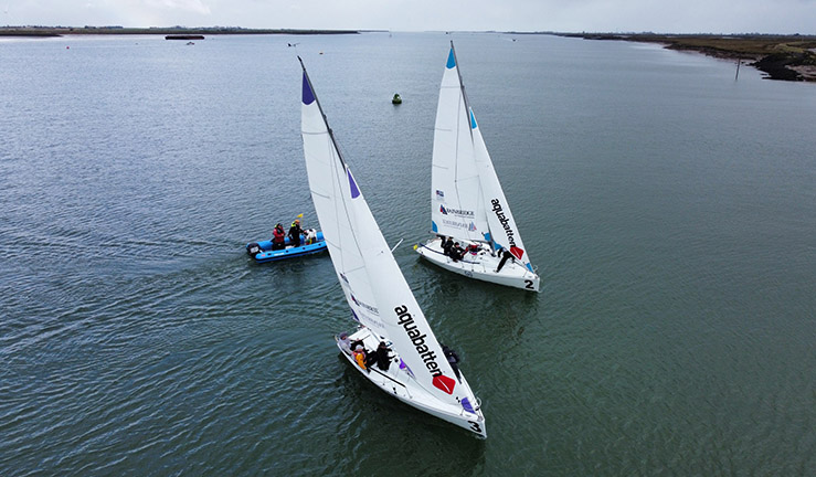 Two 707 keelboats match racing upwind at Burnham.