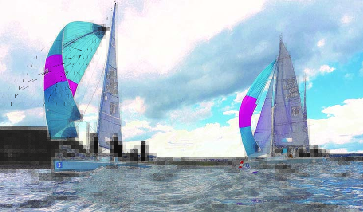 Two 707 keelboats racing downwind in the bay at Scarborough