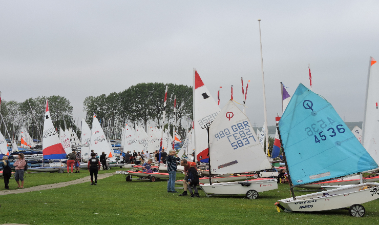 Dinghies lined up on the shore ready to launch