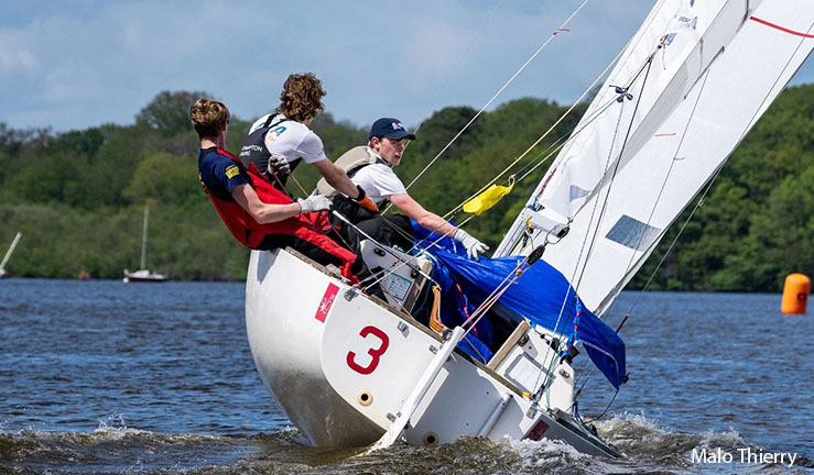 Ben Tylecote, Terry Hacker and Jamie Tylecote pictured sailing a J22 keelboat upwind at the Eurosaf Youth Match Racing European Championship in Nantes, France, 2023