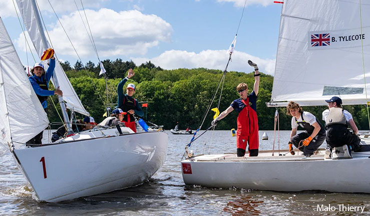 Ben Tylecote's team pictured on course with another team in J22 keelboats at the Eurosaf Youth Match Racing European Championship in Nantes, France, 2023