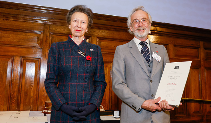 Julian Bridges is presented with an RYA Volunteer Award by HRH The Princess Royal. 