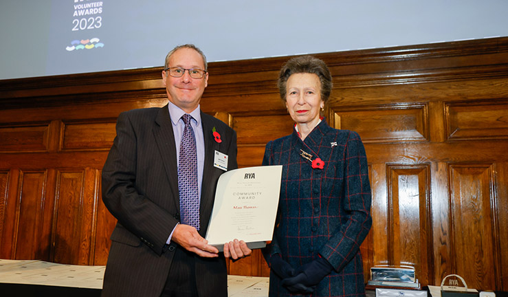 Matt Thomas is presented with an RYA Volunteer Award by HRH The Princess Royal. 