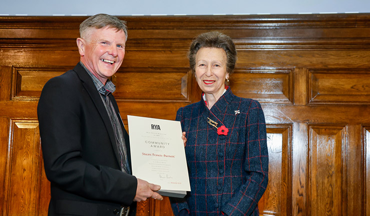 Francis Stuart Burnett is presented with an RYA Volunteer Award by HRH The Princess Royal. 