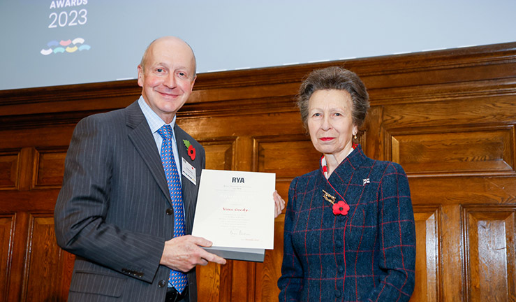Vince Grealy is presented with an RYA Volunteer Award by HRH The Princess Royal. 