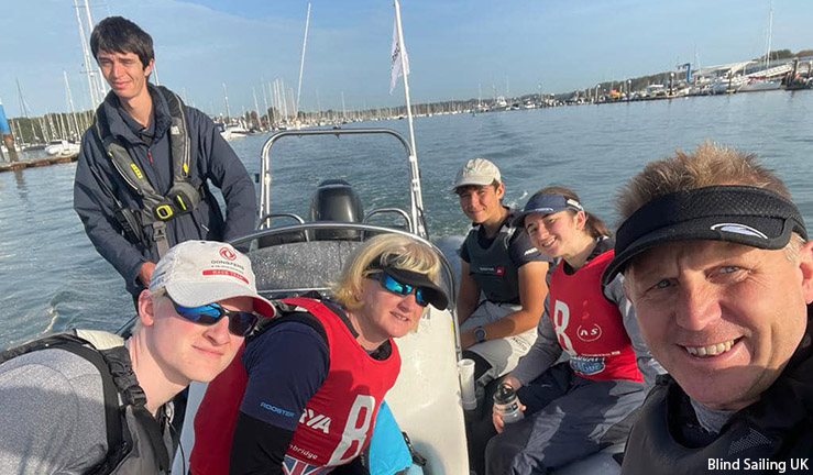 Blind Sailing UK team smiling for a selfie on a support RIB driven by Royal Southern YC's James Ripley at the British Keelboat League final 2023.