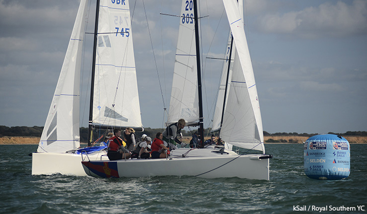 Two teams aboard J70s rounding a windward mark at the British Keelboat League final 2023.