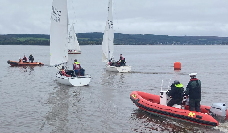 Three Sonar keelboats and two RIBS on the water on a great day at Royal Northern & Clyde YC for the 2023 Ceilidh Cup match racing event.