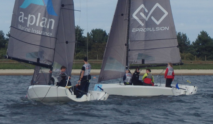 Two RS21 keelboats racing in close quarters at the RYA Summer Match Racing Q2 event at Queen Mary SC, 2023.