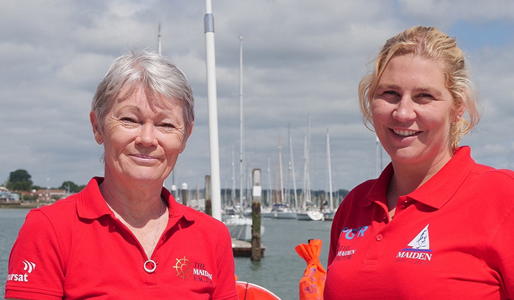 Original Maiden skipper Tracy Edwards (left) with Maiden skipper for the Ocean Globe Race 2023, Heather Thomas, smiling in red Maiden Factor T shirts.
