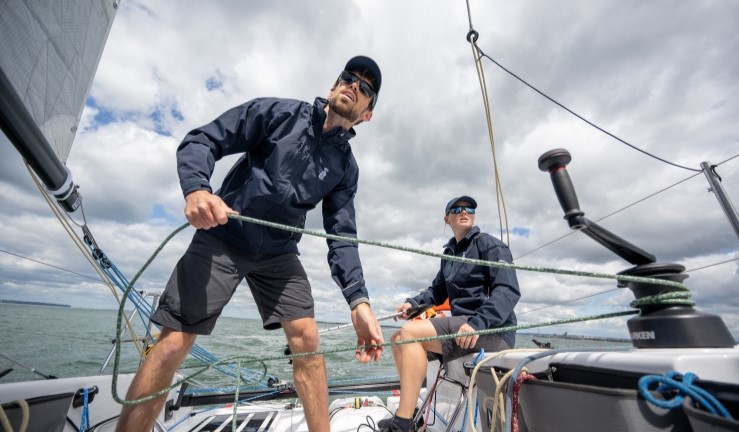 Close up of Maggie Adamson & Calanach Finlayson onboard and sailing a Sun Fast 30.