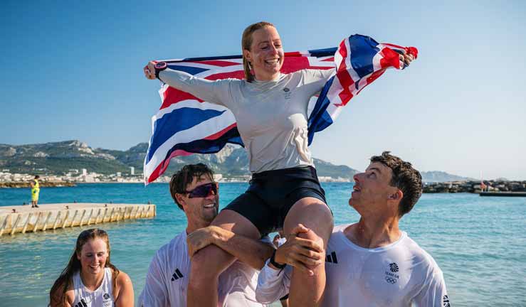 Ellie Aldridge celebrates gold with team members