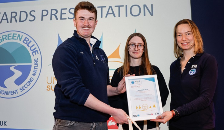 Two students collecting their award