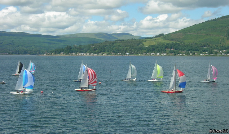 A lovely summers day overlooking the Clyde as a fleet of keelboats with colourful sails.