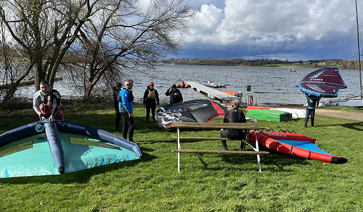 Group on shore at Rutland Sailing Club getting ready to go afloat with wings at RYA Midlands Regional Training Day 2023.