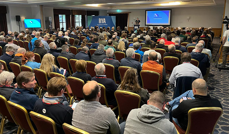 Representatives from clubs and centres in the Midlands were among the delegates at the RYA Training Conference 2024 - this is a picture from the back of the main conference room which is packed with people listening to a presentation.