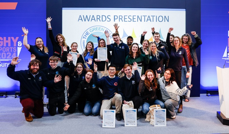 University students collecting their awards on stage