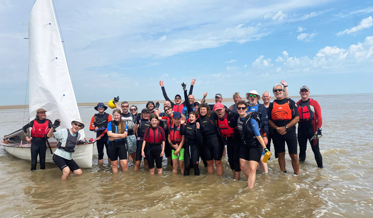 Group of people waving in water 