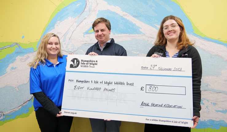 Representatives from the RYA and HIWWT meet for a cheque presentation