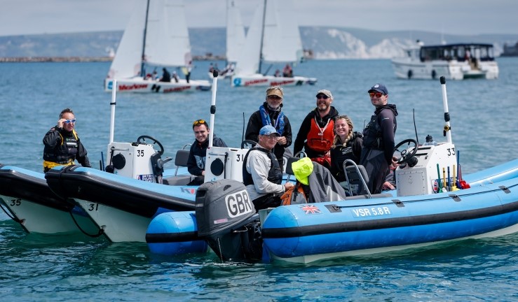 Volunteers aboard blue RIBs for umpires/changeovers at the RYA Harken Youth Match Racing Championship 2024. 