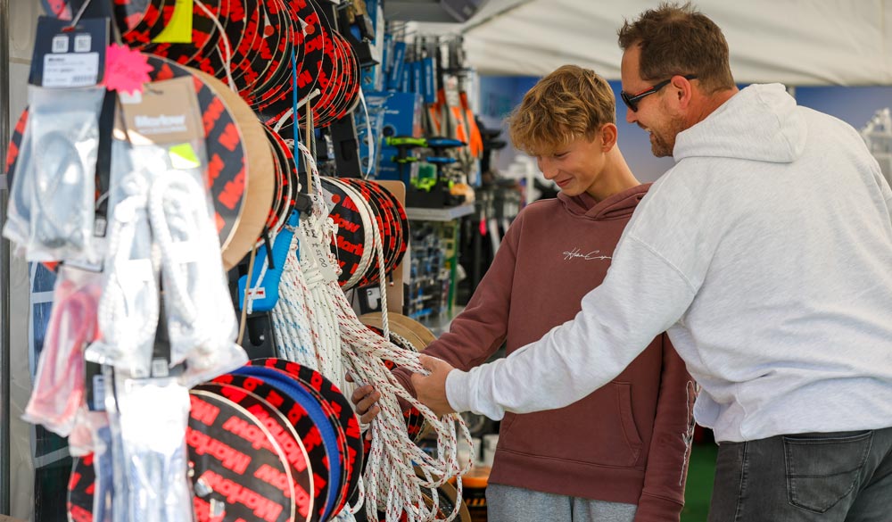 man and son shopping for rope at southampton international boat show