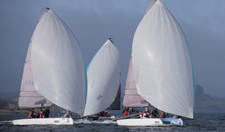 Three RS21s racing with white spinnakers flying in the sunshine at Rutland Sailing Club