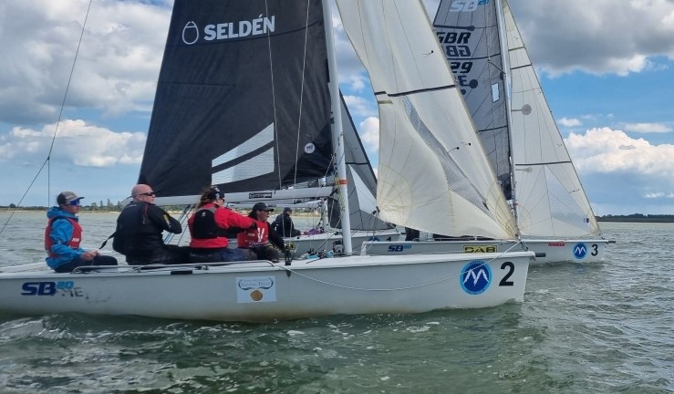 SB20 keelboats lining up for a start during for Qualifier 4 of the British Keelboat League on the Blackwater Estuary.