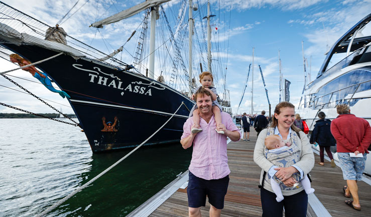 Family walking along dock at Southampton Boat Show