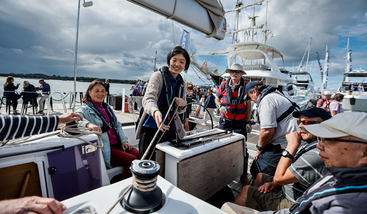Family in yacht cockpit at Southampton Boat Show