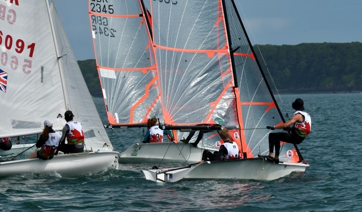 Two 29ers and a 420 coming off a startline at the Welsh Regional Junior Championships 2024.