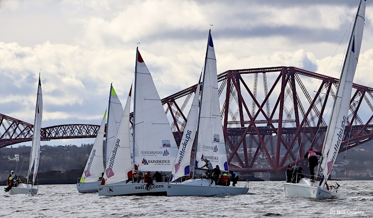 Fleet of 707 keelboats racing upwind on a grey day with Forth Bridge in background for Scottish qualifier of British Keelboat League 2024.